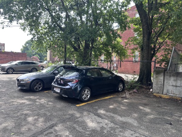Same parking lot fully cleared with cars undamaged and accessible