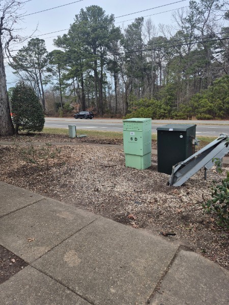 Same roadside area fully cleared after storm cleanup